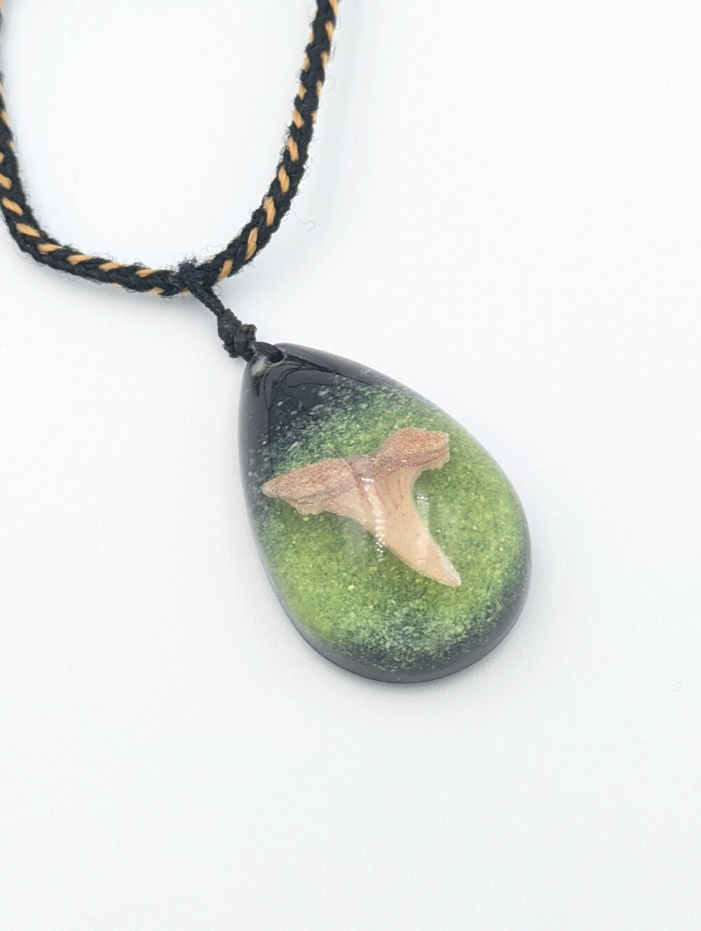 Shark tooth in resin with green sand pendant necklace on cord